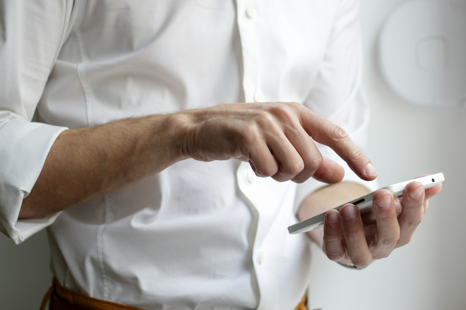 Using a business app on a mobile phone Person using a business app on a smartphone